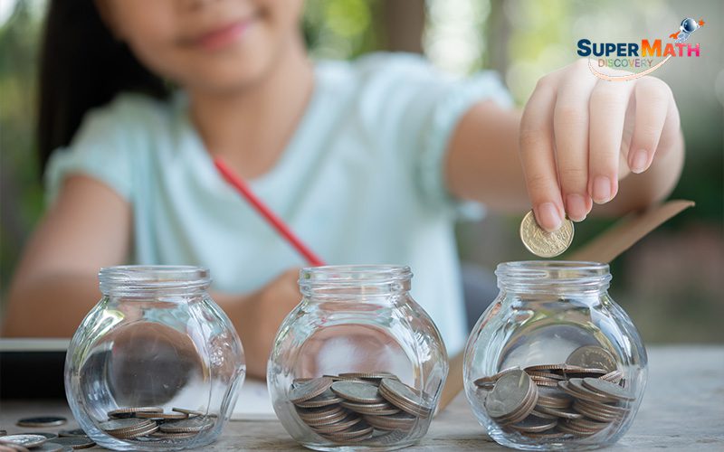 Child using coins to solve a maths word problem.