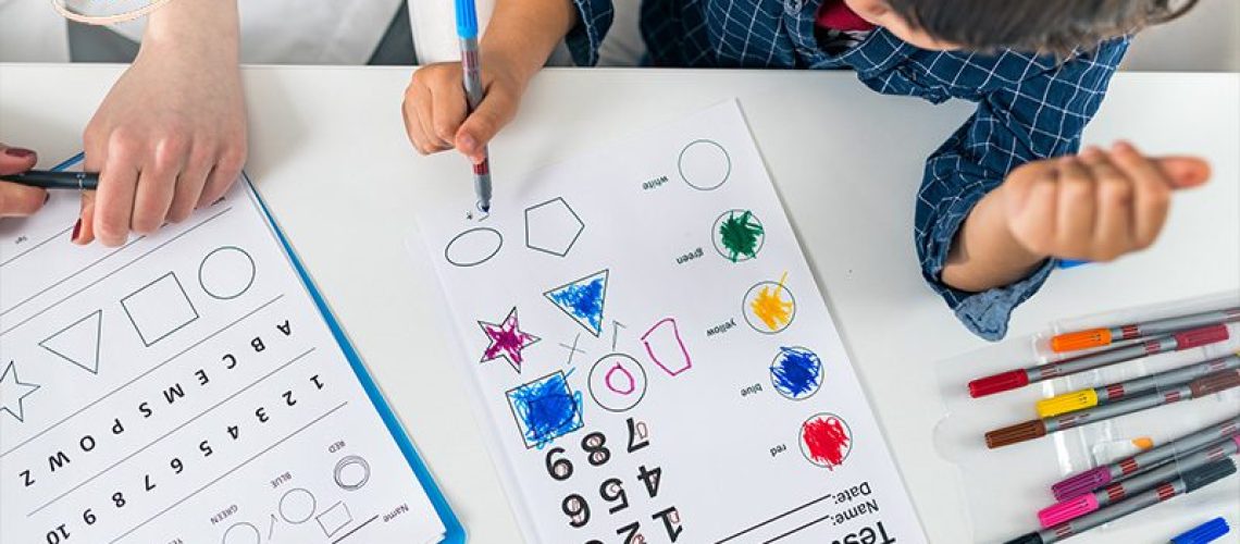 Child using a game-based learning worksheet.